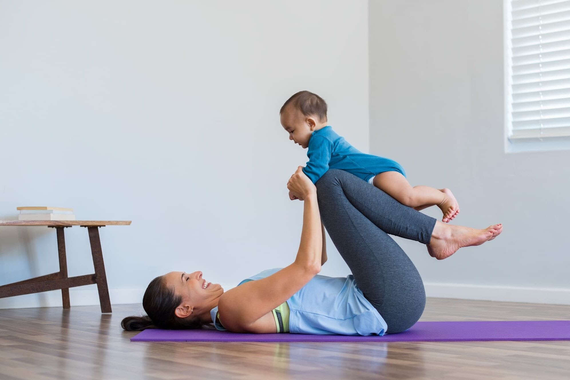 Mother and little son exercising